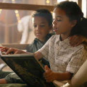 girl-reading-to-boy-mobile